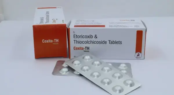 Coxita-TH, tabletki z etorykoksibem i tiokolchizydem, stosowane na bóle mięśni i stany zapalne. Dwie paczki i blistry leku.